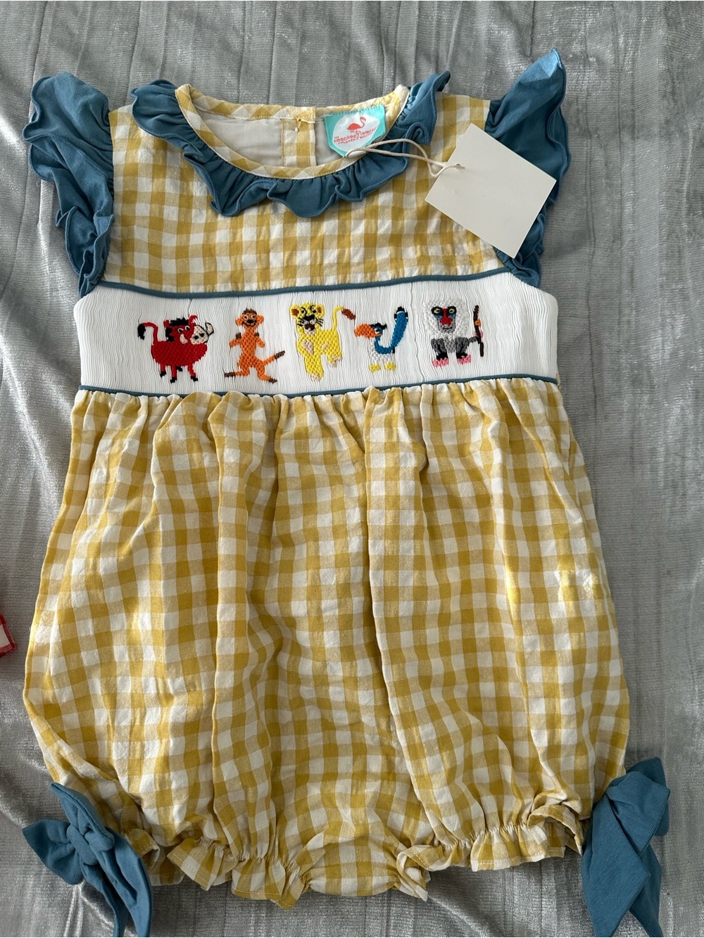 Smocked Romper with Teal trim and bow - lion king